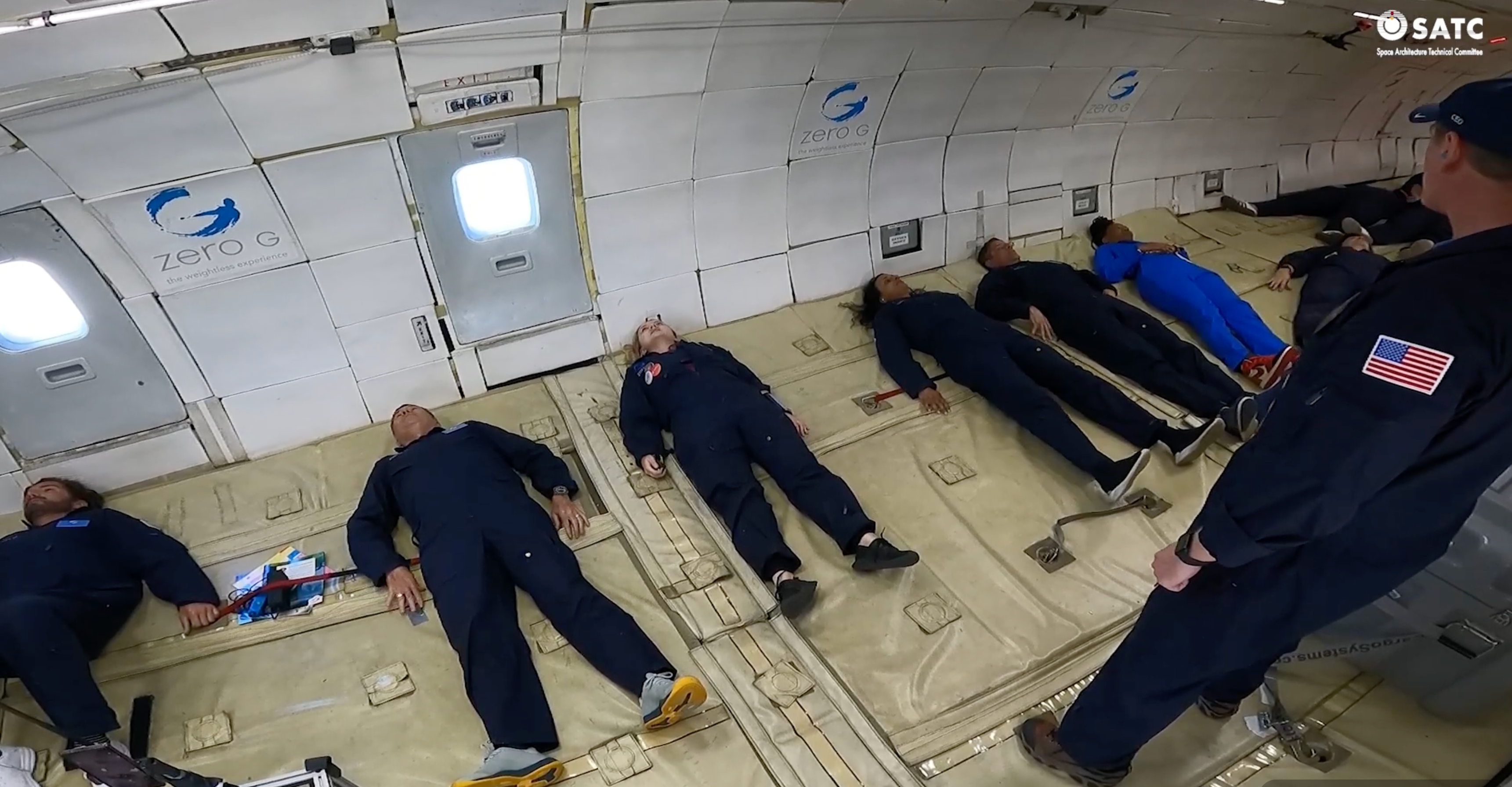 Fliers lying on the cabin floor during a parabola aboard G-Force One.
